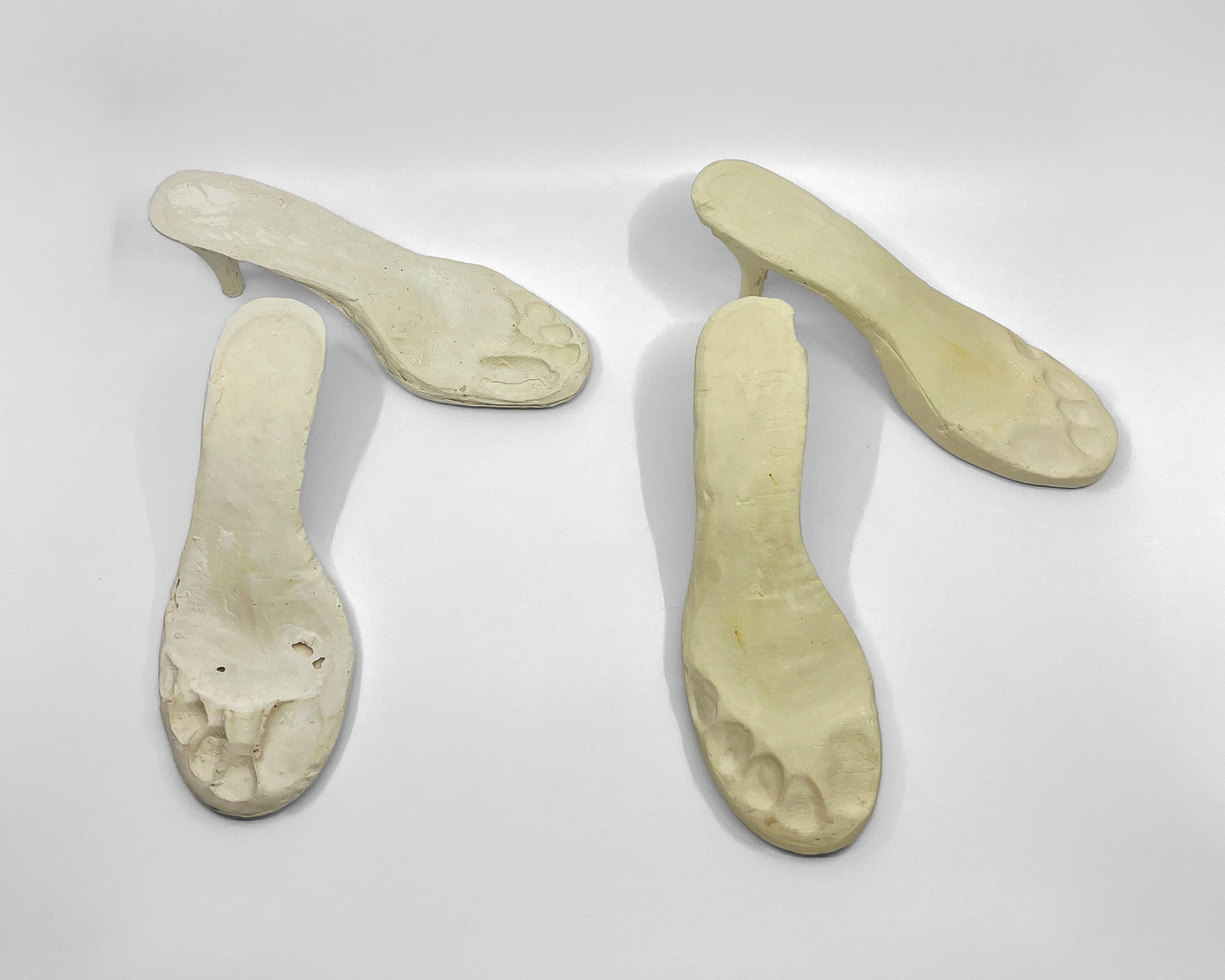 Plaster castings of shoes